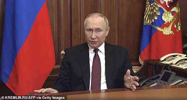 Putin is pictured in the early hours of Thursday morning declaring war on Ukraine, in what he termed a 'special military operation'