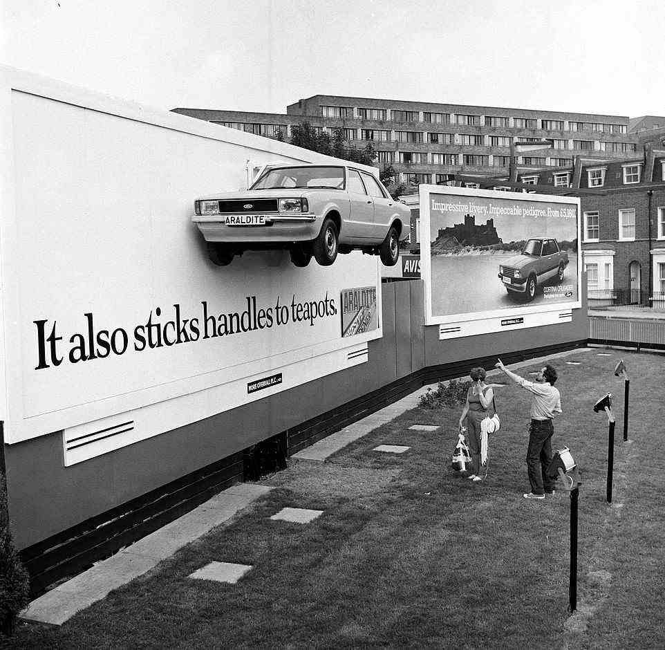 An Araldite billboard on Crowell Road in Kensington and Chelsea in 1982 shows a Ford Cortina glued to the advertising panel. Next to it is a Ford ad for the Cortina's final edition of the MkV car, which was called the Crusader. It was the last model built before the Sierra arrived