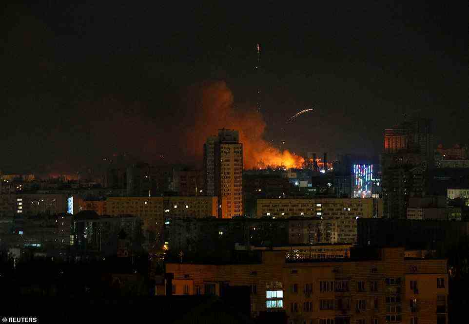 Smoke and flames are seen billowing over Kyiv's Peremohy Avenue in the west of the city, near the zoo, in the early hours of Saturday morning