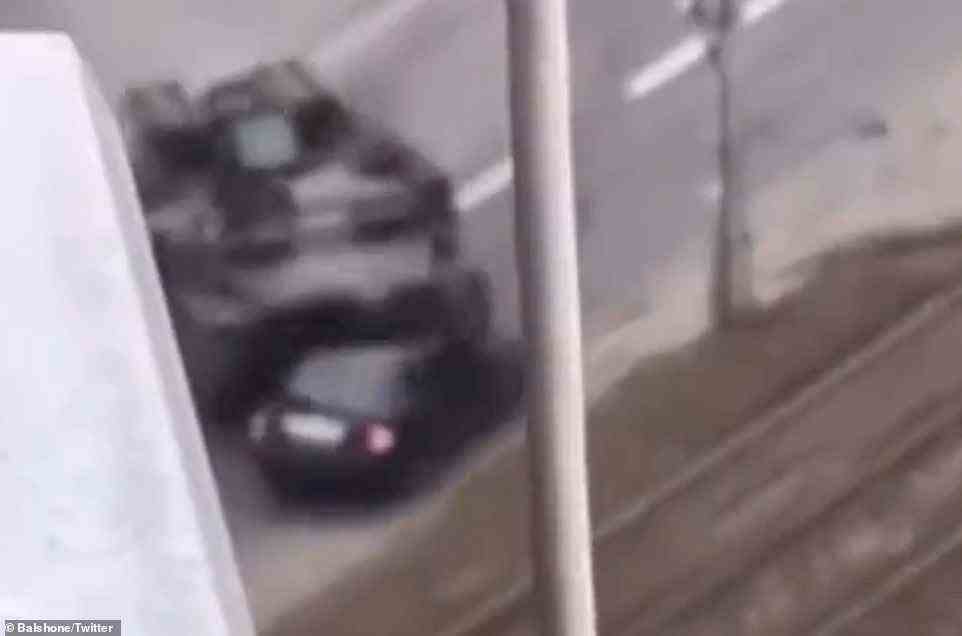 The Russian tank can be seen deliberately crossing several lanes to reach the car