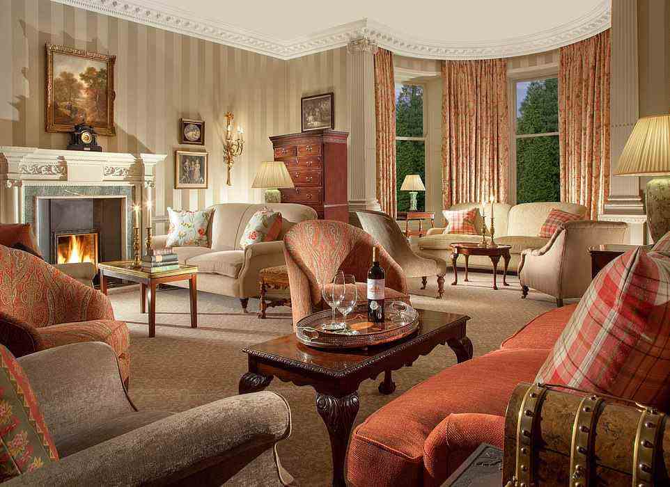 Ted writes: 'The loudest noises tend to be the occasional clinking of an ice cube in a glass of whisky and the gentle creak of a floorboard as guests amble from one plush room to another.' Pictured is one of the lounges