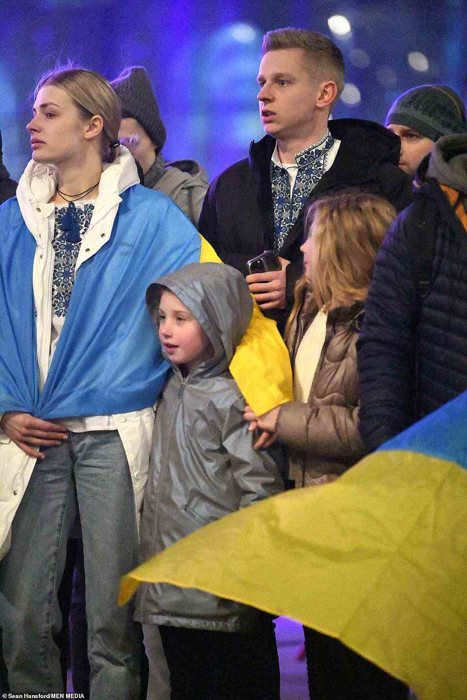 The sports reporter, who is also a popular YouTuber, was draped in the Ukrainian flag as she stood side by side with the City defender
