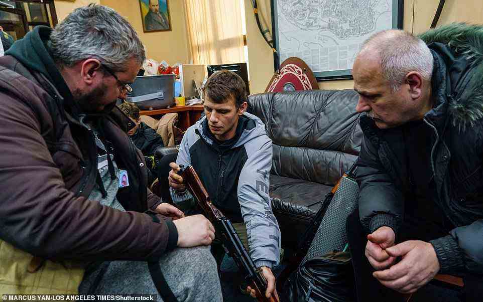 Volunteers from the Territorial Defense Units gather in an outpost to collect weapons, train and get their assignments in Kyiv