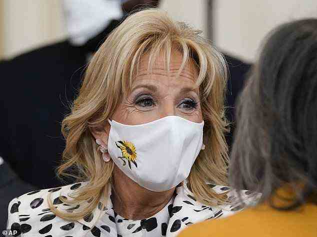 The first lady's white mask featured an sunny yellow sunflower embroidered on the side