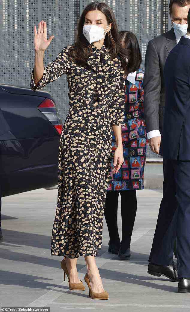 Queen Letizia of Spain was the picture of elegance in a floral gown as she stepped out alone in Madrid today
