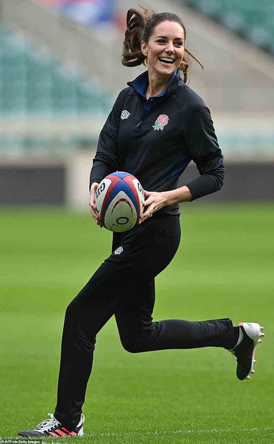 In her element! The Duchess, dressed head-to-toe in England Rugby kit, beamed as she joined players for a training session
