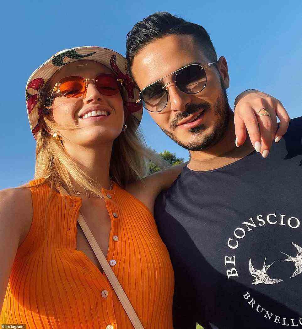 Prepare to meet the 'Tinder Swindler's girlfriend - a Ukraine-born Israeli model who is sticking by the convicted felon, despite him allegedly scamming women out of hundreds of thousands of dollars. They are pictured together in July 2021