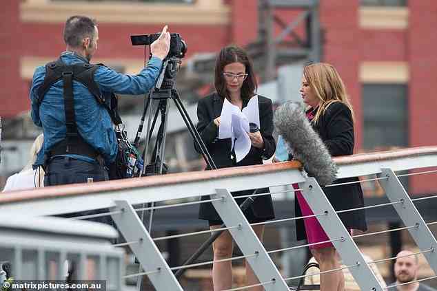 Reading lines: Tammin was also spotted leafing through a script during a break from filming, peering down at the white papers in her hand