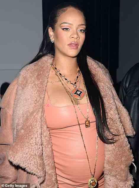 Stunning: The singer, 34, sizzled in a nude mini dress and shearling coat which she teamed with strappy heels