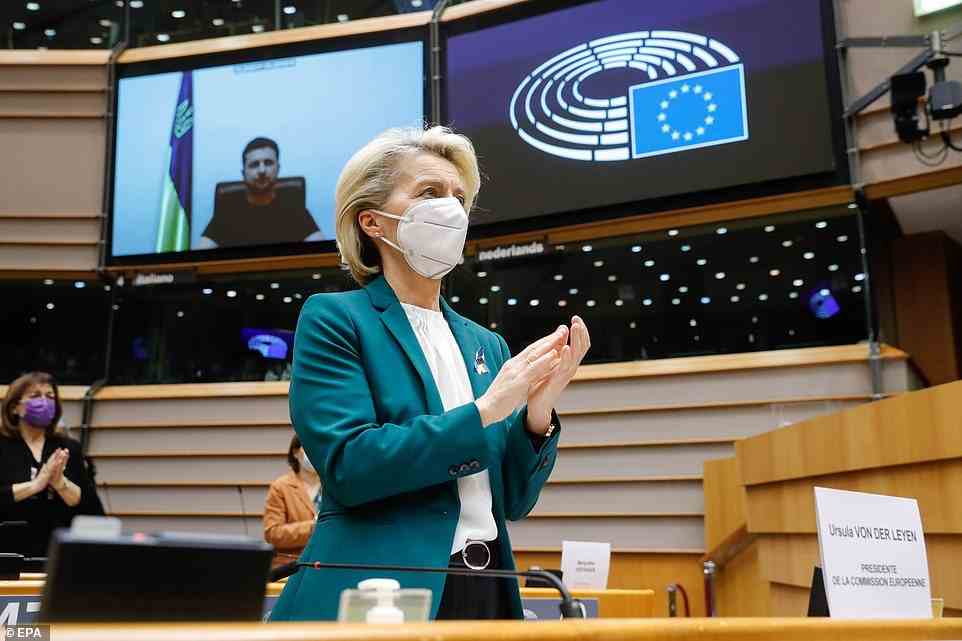 EU Commission President Ursula von Der Leyen applauds the end of Zelensky's speech, after he said that Ukrainians were sacrificing their lives for the freedoms that Europe represents