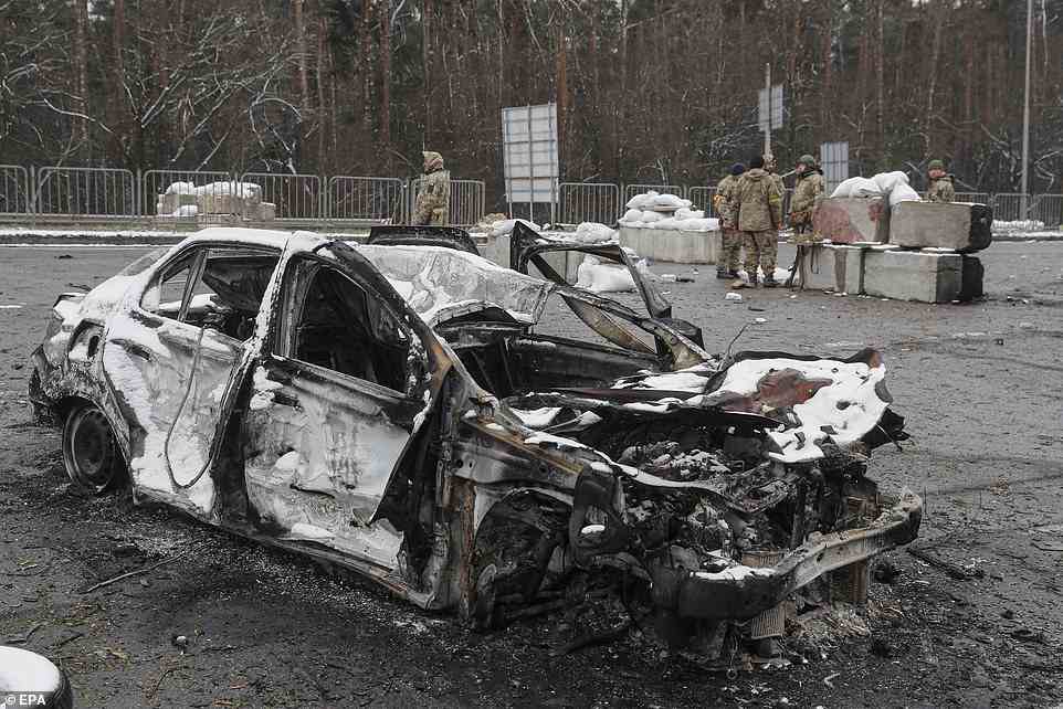 damaged vehicle in the aftermath of an overnight shelling at the Ukrainian checkpoint in Brovary near Kyiv