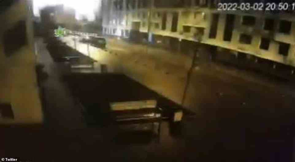 A Russian air strike hit near Kyiv's southern rail station on Wednesday where thousands of women and children are being evacuated, Ukraine's state-run railway company Ukrzaliznytsya said in a statement. Pictured: Footage purportedly showing a blast in Kyiv on Wednesday night near a southern train station and Ukraine's Ministry of Defense