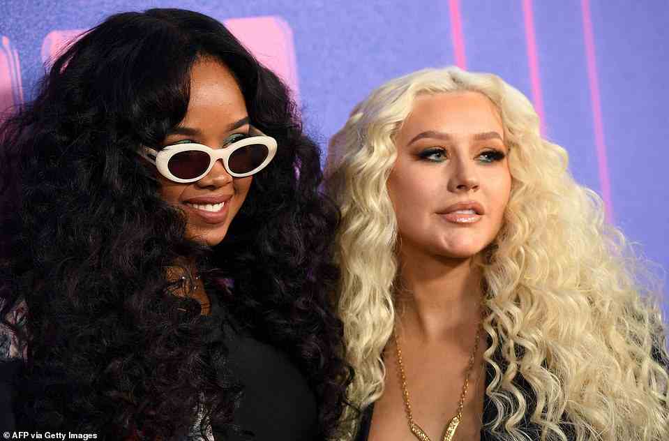 Smiley: H.E.R. and Aguilera beamed for shutterbugs