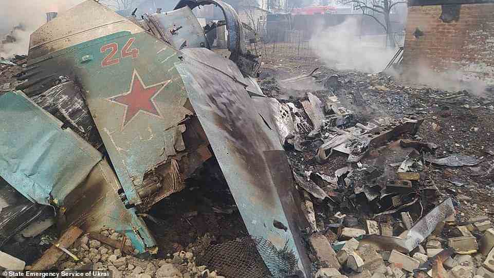 This handout picture released by the State Emergency Service of Ukraine on March 5, 2022, shows what is said the wreckage of a Russian military aircraft on the outskirts of the city of Chernihiv