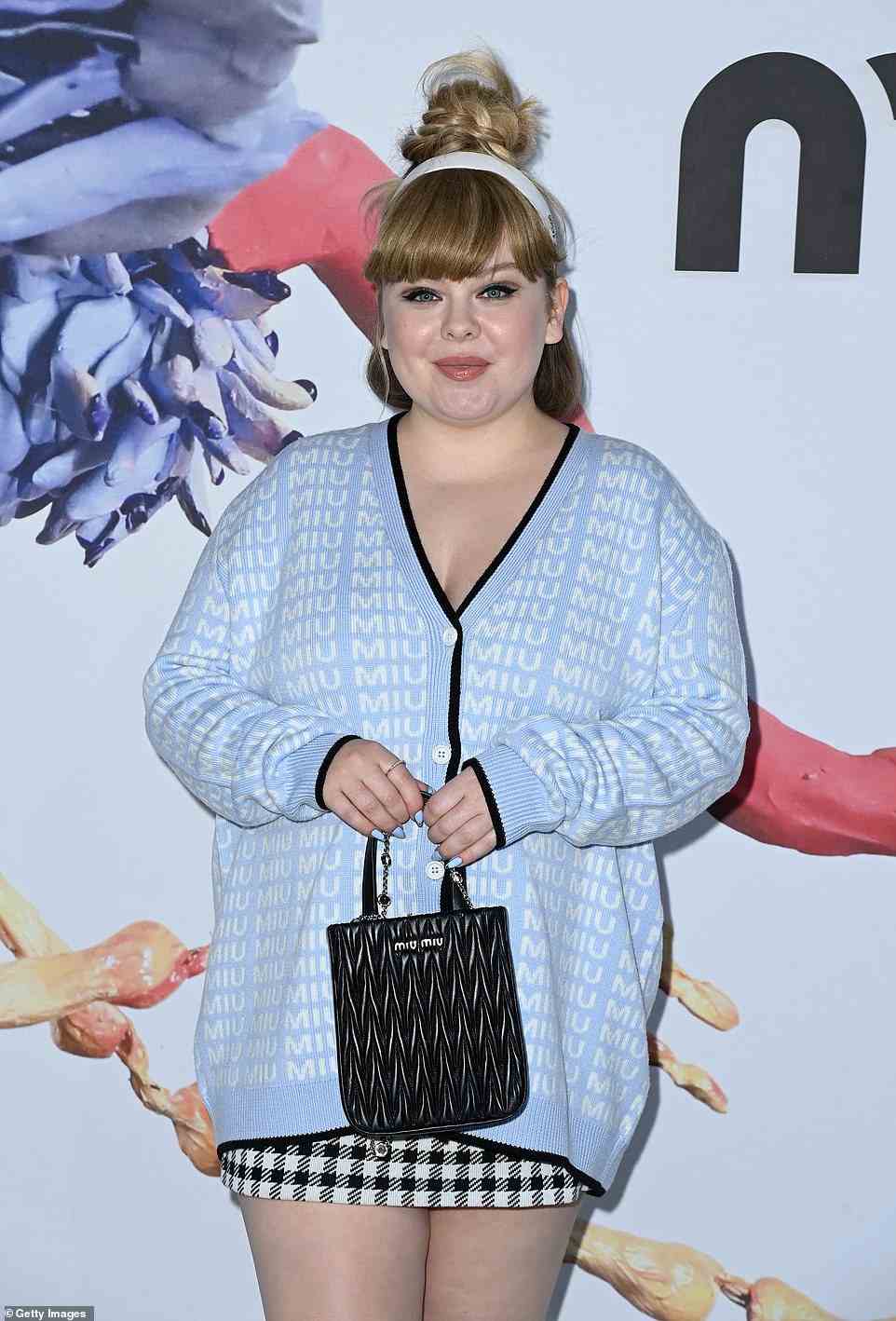 Leggy: Nicola Coughlan showed off her pins in a very short black and white skirt and light blue Miu Miu jumper