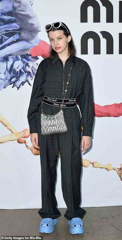 Quirky display: Ever Anderson teamed her black checked co-ord with a pair of chunky blue croc-style shoes