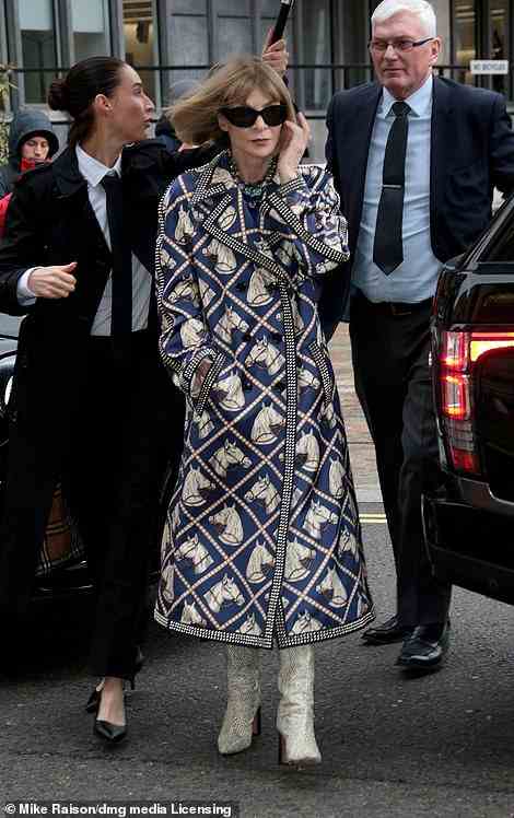 Queen of fashion: Anna Wintour wore a blue and white coat for the event