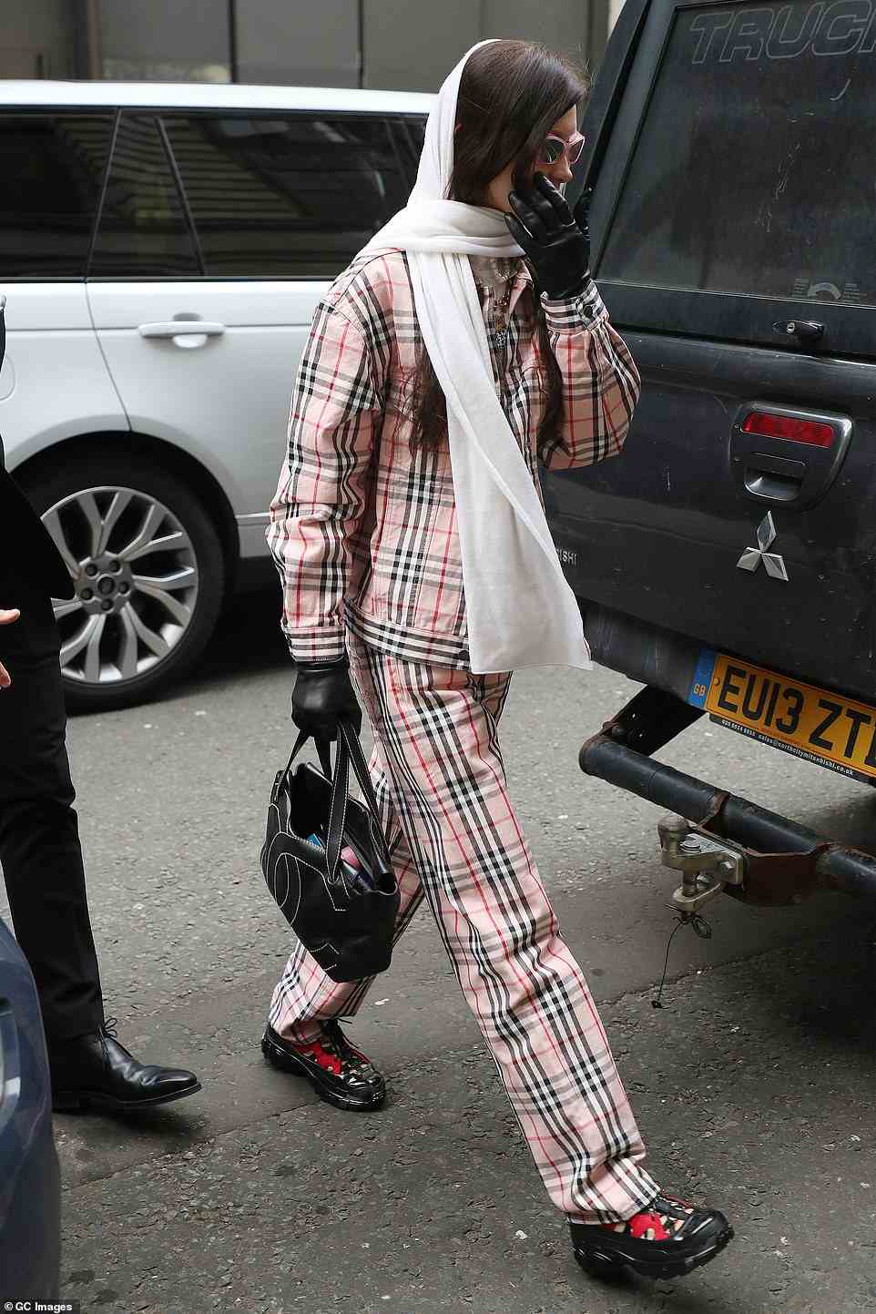 Quirky: Bella showed off her out-there sense of style in the pink checked ensemble