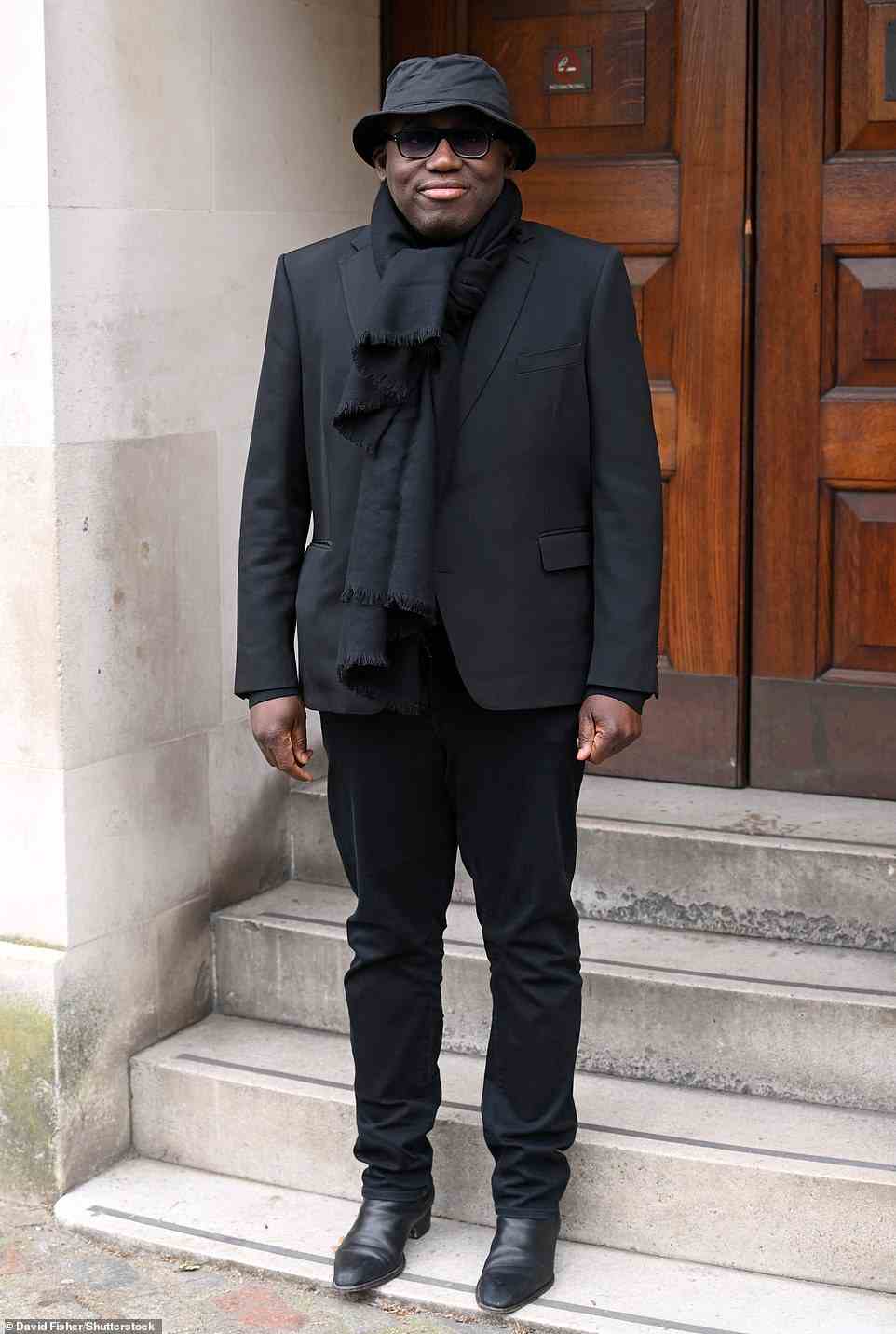 Chic: Vogue's Edward Enninful wore an all-black ensemble and a black scarf for the fashion event