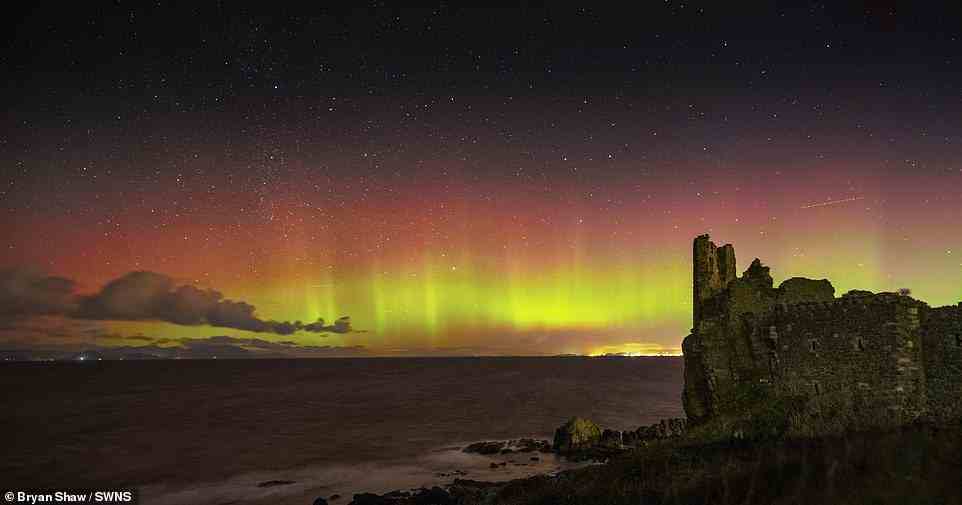 Aurora over Scottish landscape. There are two types of Aurora - Aurora Borealis, which means 'dawn of the north', and Aurora Australis, 'dawn of the south'. The displays light up when electrically charged particles from the sun enter the Earth’s atmosphere