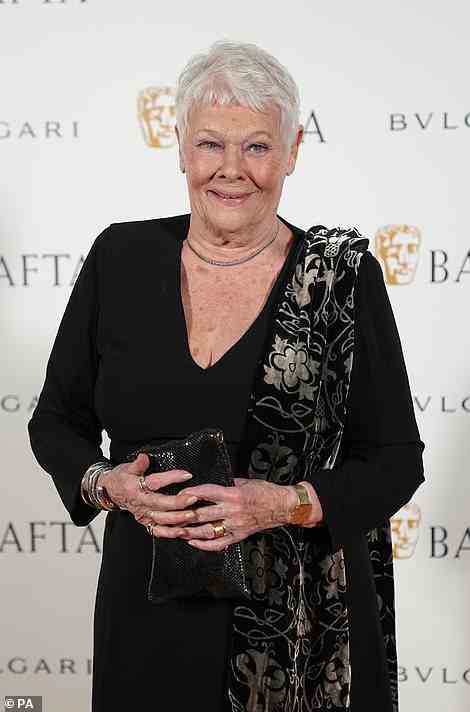 Legend: Dame Judi Dench looked ever-graceful in an all-black ensemble