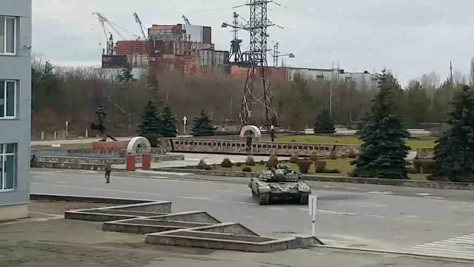 Russian forces took control of the power plant, which is located to the north of Kyiv, in the early days of fighting (pictured, Russian tanks at the site) and have since shut off the power which runs the cooling system, and disconnected