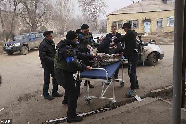 Russian attacks have made the delivery of medical care to Ukrainians for all conditions a challenge due to limited supplies, destroyed facilities and dangerous circumstances. Pictured: An injured man is carried to a hospital in Mariupol