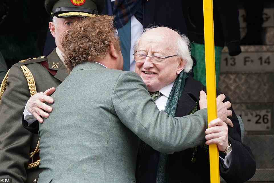 American-Irish actor John C. Reilly and President Michael D higgins shared a hug as they met at the St Patrick's Day Parade in Dublin