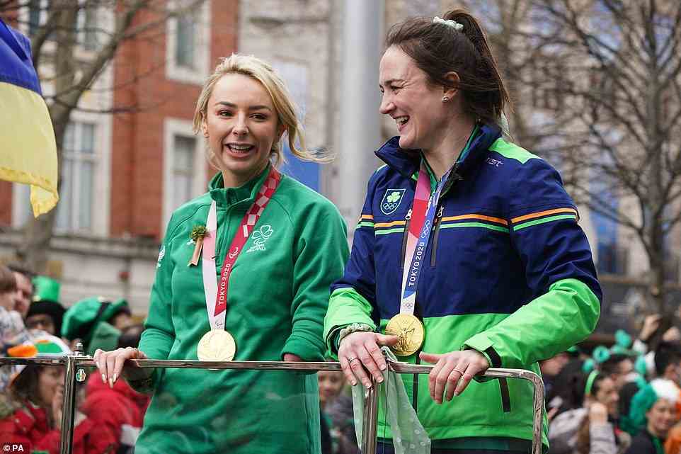 Grand Marshals Paralympic gold medal swimmer Ellen Keane (left) and Olympic gold medal boxer Kellie Harrington (right) take part in the St Patrick's Day Parade in Dublin