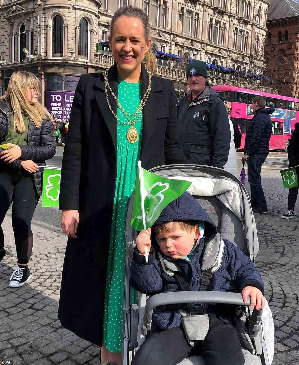 Northern Irish politician Lord Mayor Kate Nicholl was pictured with her son Cian as they attended the St Patrick's Day Parade in Belfast