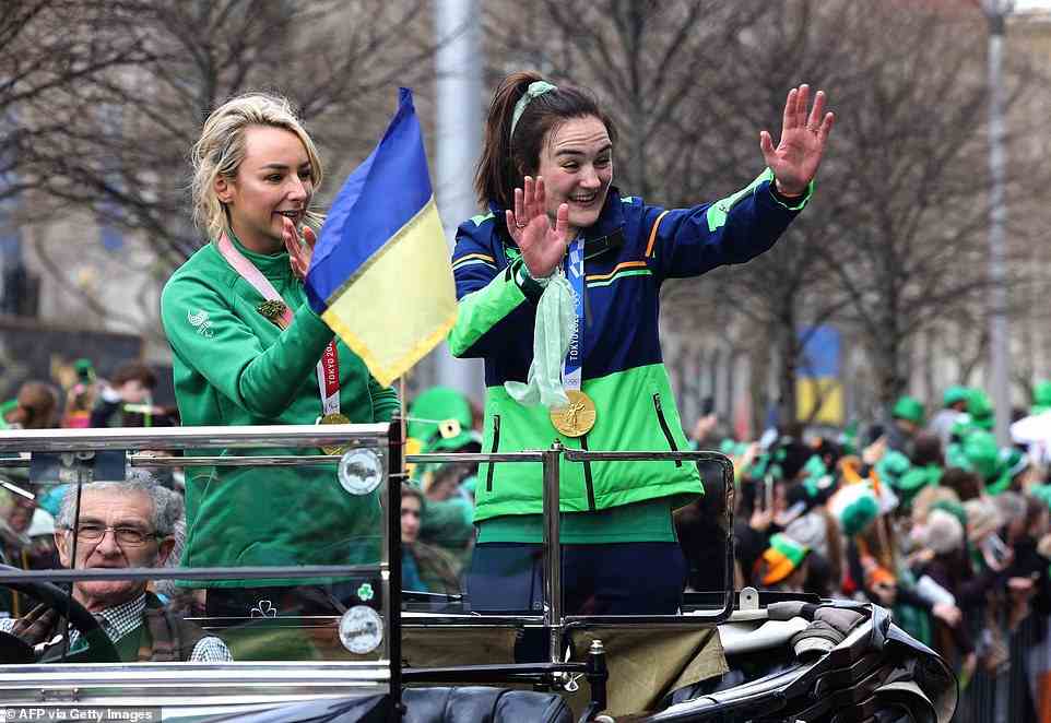 Grand Marshals Paralympic gold medal swimmer Ellen Keane (left) and Olympic gold medal boxer Kellie Harrington (right) waved to the crowds at the event today