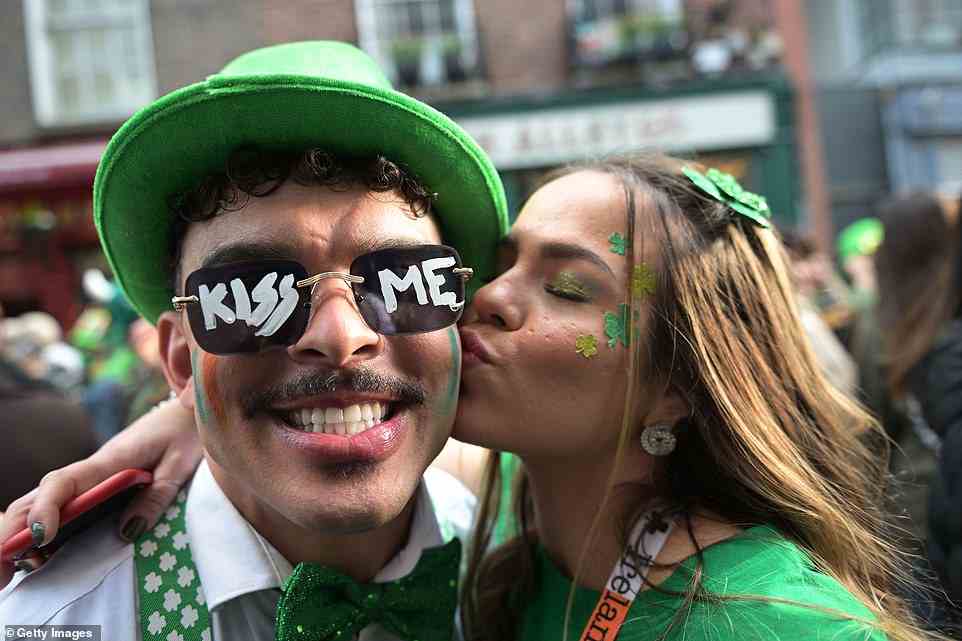 One reveller donned a pair of Kiss Me emblazoned sunglasses as he joined the thousands of others celebrating Saint Patrick's Day in Dublin