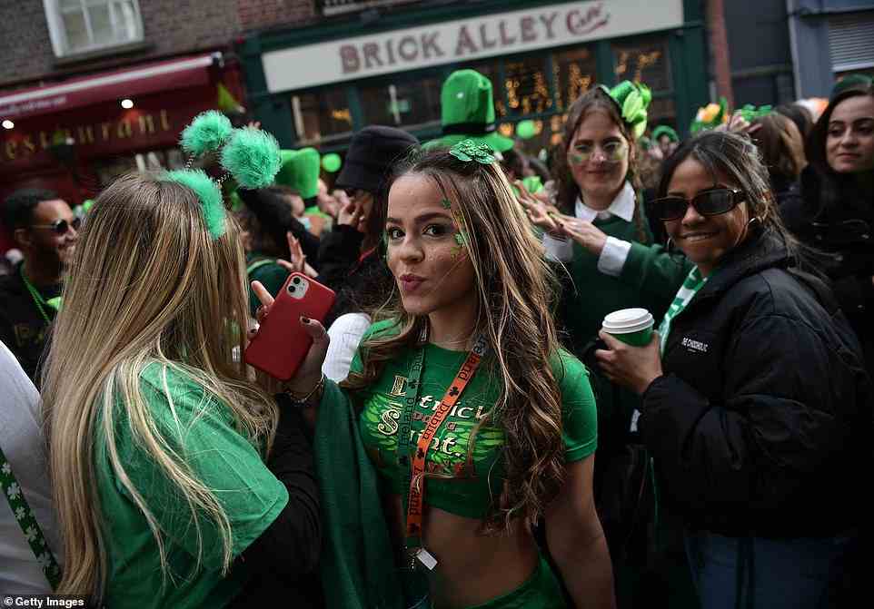 A group of women wore green outfits and accessorised with St Patrick's Day themed hair bands as they took to the streets