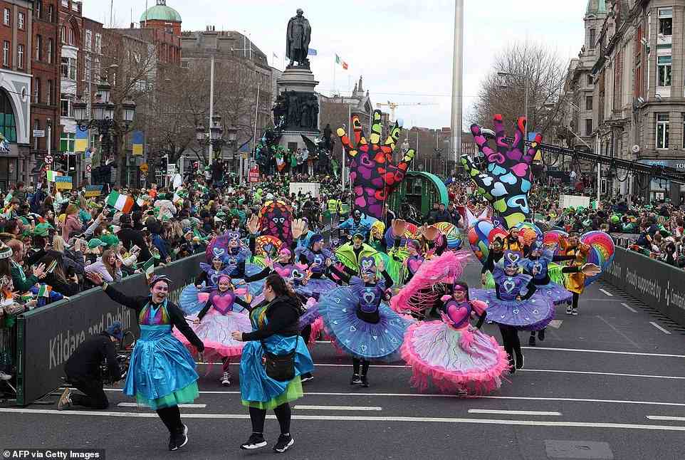 Performers danced through the streets of Dublin as they celebrated St Patrick's Day with a parade for the first time in two years