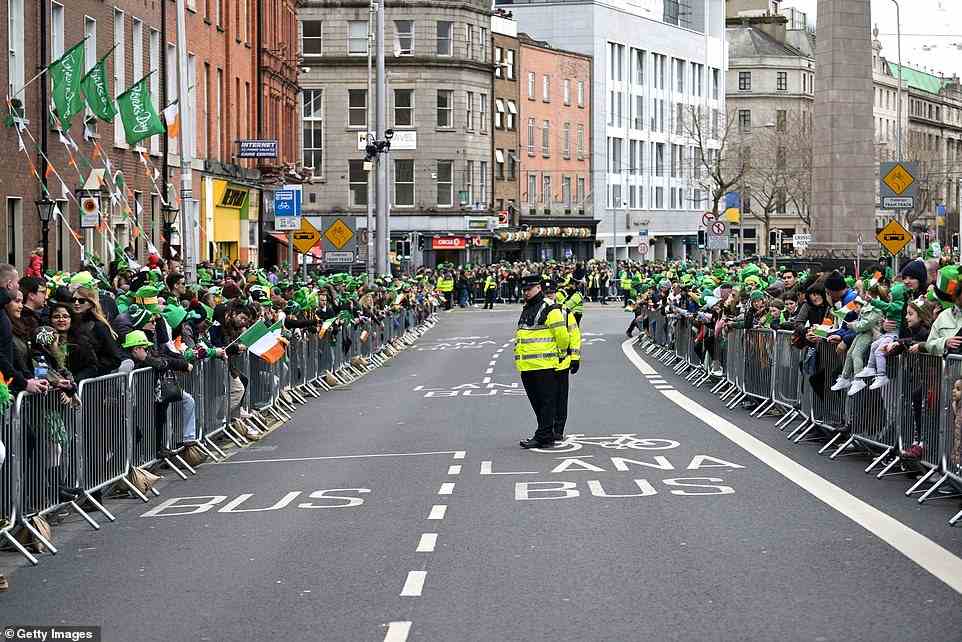 With up to 400,000 people expected to attend the traditional parade in Dublin the streets were crammed with revellers ahead of the parade