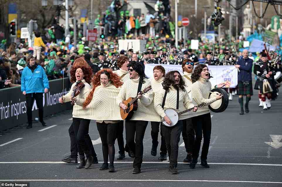Performers sang and played instruments through the streets of Dublin as they celebrated St Patrick's Day with a parade for the first time in two years
