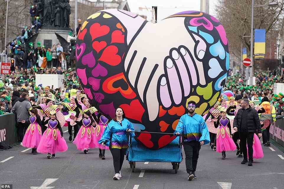 Performers at the St Patrick's Day Parade in Dublin walked through donning colourful outfits and carrying elaborate bloons on floats