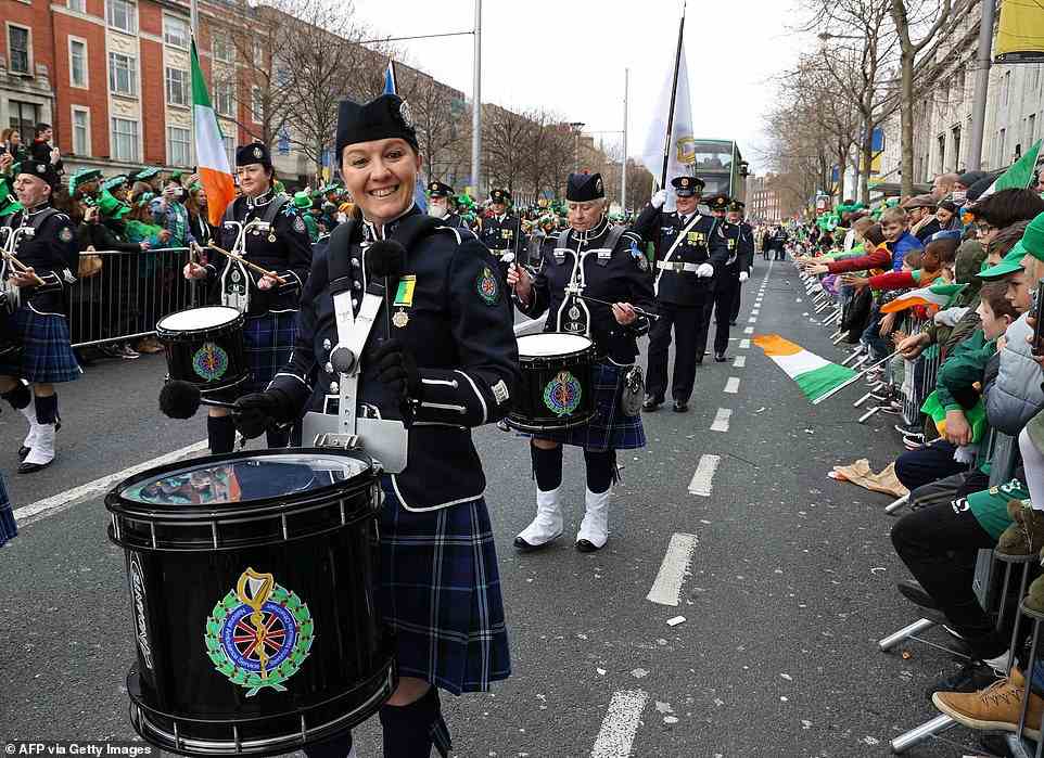 Members of the National Ambulance service pipe band perform during the annual St Patrick's Day parade in Dublin