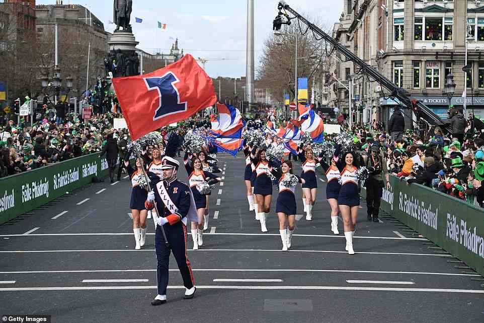 A cheerleading squad take part in the annual St Patrick's Day parade as crowds cheered them on in Dublin today