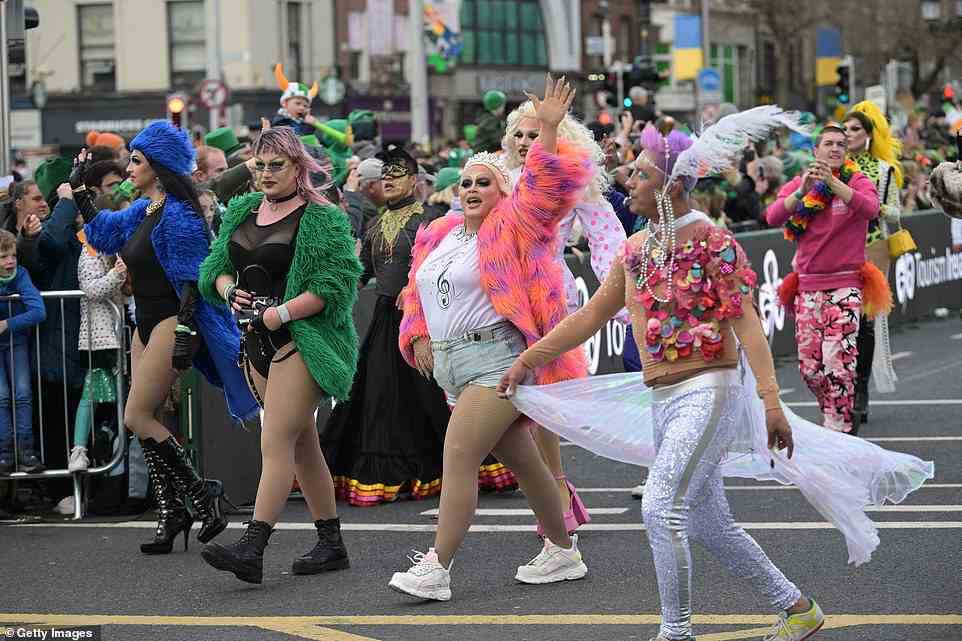 Drag performers donning colourful outfits waved at the crowds as they took part in the St Patrick's Day parade in Dublin today