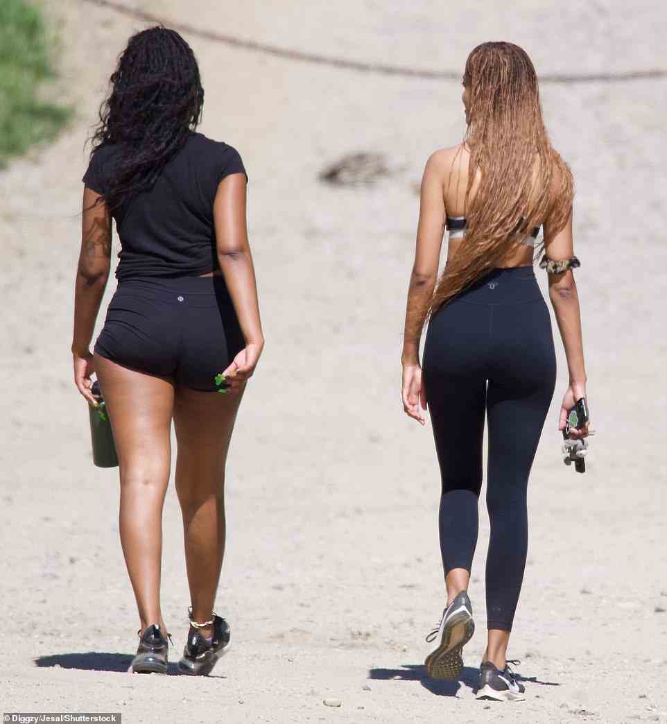 Both girls showed off their long hair, which trailed down their backs as they strolled