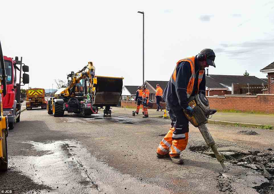No contest: one of the roadworkers using traditional repair methods gets to work with a 32kg jackhammer while the PotholePro starts its rapid job of digging out the damaged section of road