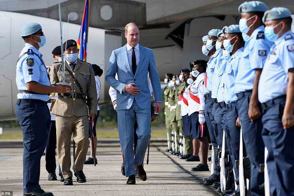 The Duke of Cambridge with the Honour Guard as he arrives at Philip S. W Goldson International Airport, Belize City