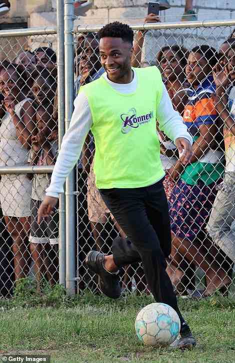 Raheem Sterling is seen playing football in Trench Town as the royal couple visit the historic area
