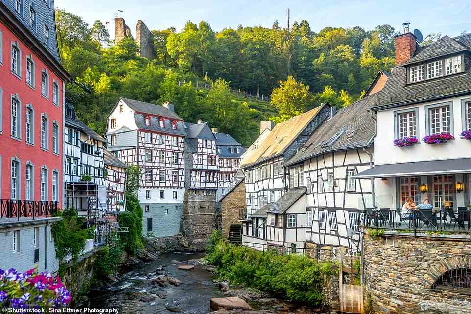 Carlton stopped to spend the night in medieval Monschau (pictured), accessed by a dirt path down from the trail