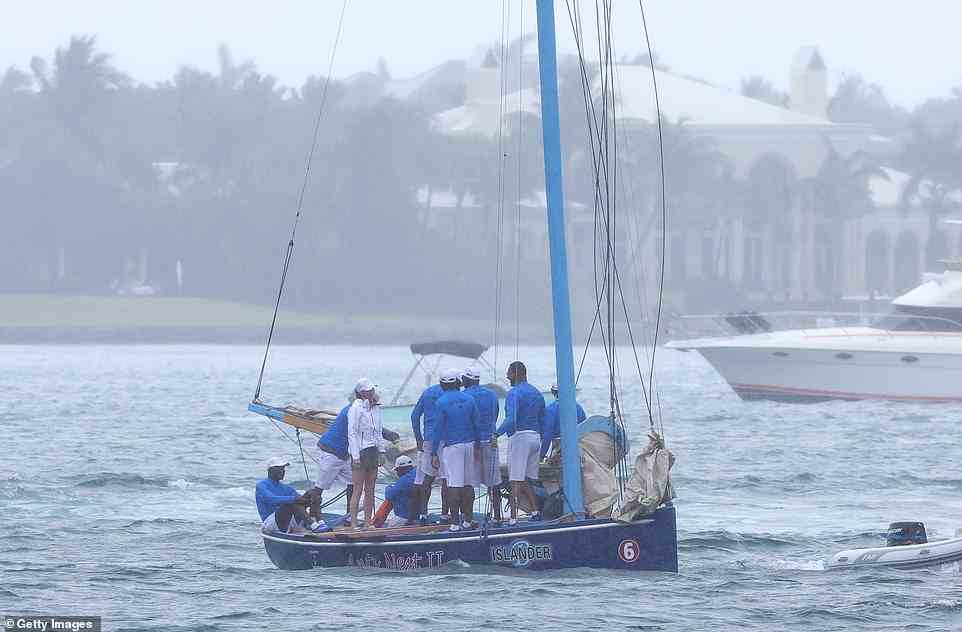 The Duchess of Cambridge stood alongside eight crew members of the Ants Nest II vessel after the race with her husband William