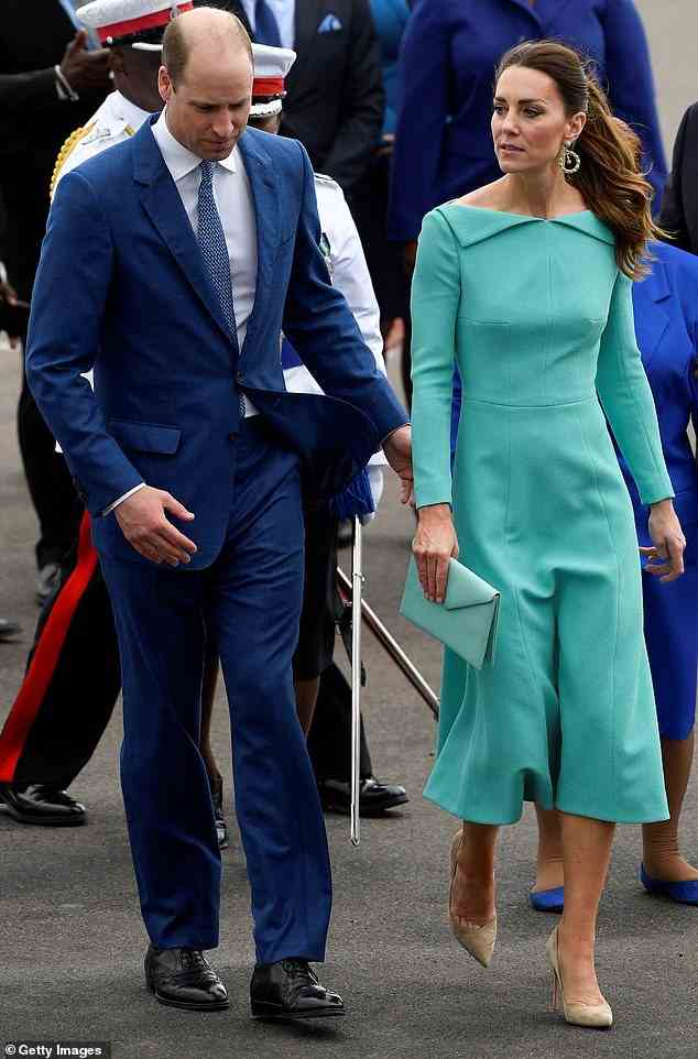 Prince William gently led his wife off the airport's tarmac with a subtle forearm touch after their arrival in Nassau in the Bahamas on Thursday