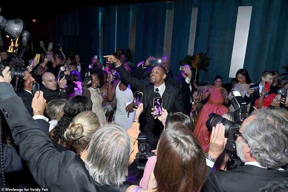 Popular: Will was pictured in the middle of the crowd, dancing and cheering with fellow stars