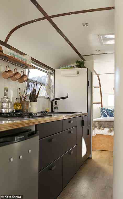 Based in Denver, Tracey Gobey and James Grenfell took on the challenge of upgrading an old aluminium Spartan trailer, the book explains, adding that the couple went for bold design choices, from the matte-black sink and faucet in the kitchen and a glossy white countertop to the playful white penny tiles in the bathroom which spell out 'Get Naked!' The project cost $25,000 (£19,000). Follow along - @wayfare_ranch