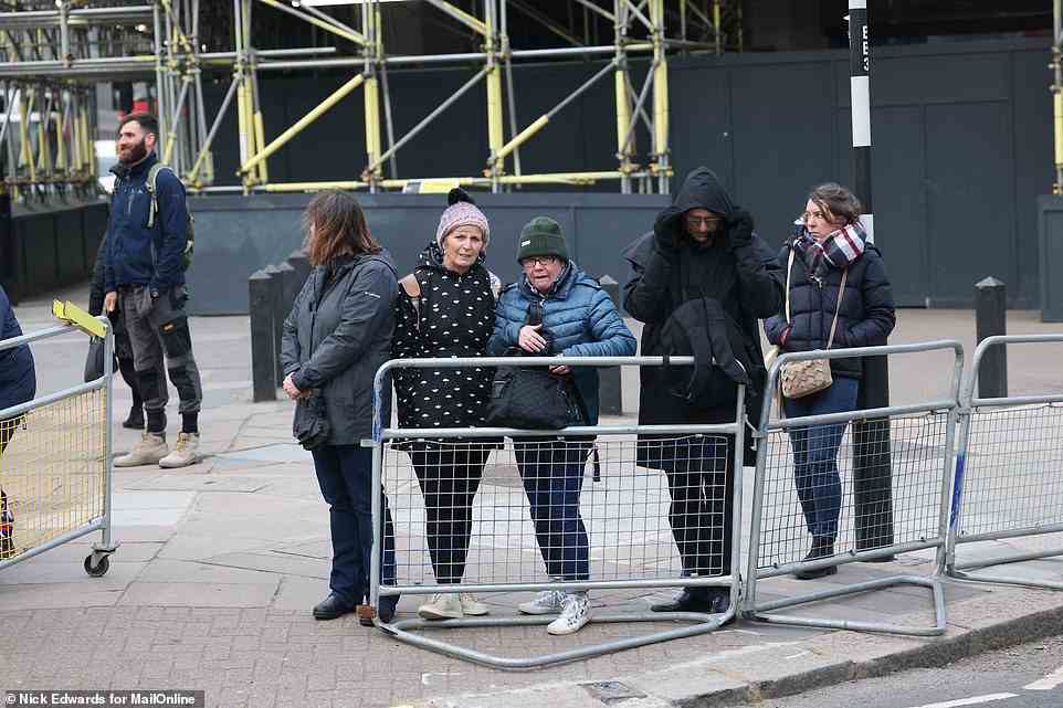 Royal fans wait outside Westminster Abbey this morning ahead of the service for the late Duke of Edinburgh